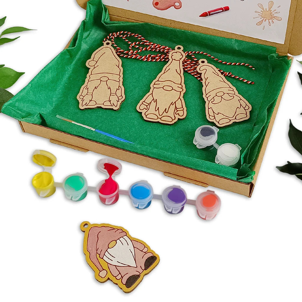 Decorative gnome ornaments with paint and paintbrushes