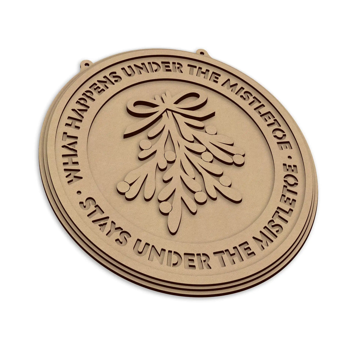 An round Christmas plaque featuring a laser-cut mistletoe design and the text 'WHAT HAPPENS UNDER THE MISTLETOE STAYS UNDER THE MISTLETOE', shown on a plain white background.