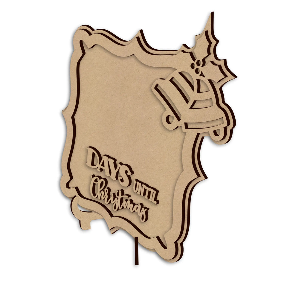 A laser-cut wooden Christmas sign with a jingle bell, holly, and the text 'DAYS UNTIL Christmas', shown on a plain white background.