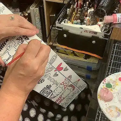 Hand painting one of our Christmas Eve boxes