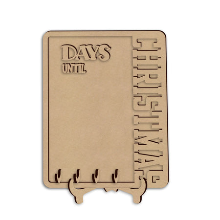A wooden Christmas countdown plaque on a small stand, featuring the words 'DAYS UNTIL CHRISTMAS', shown against a plain white background.