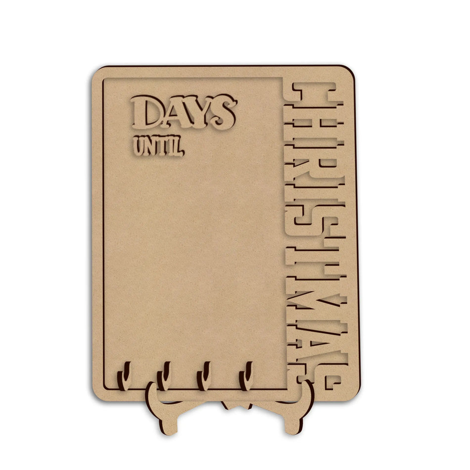 A wooden Christmas countdown plaque on a small stand, featuring the words 'DAYS UNTIL CHRISTMAS', shown against a plain white background.