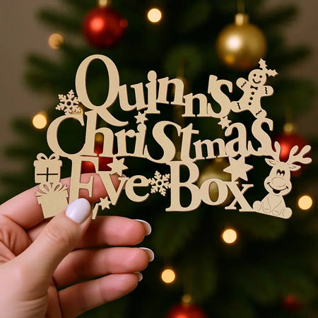 funky font christmas box topper held in hand