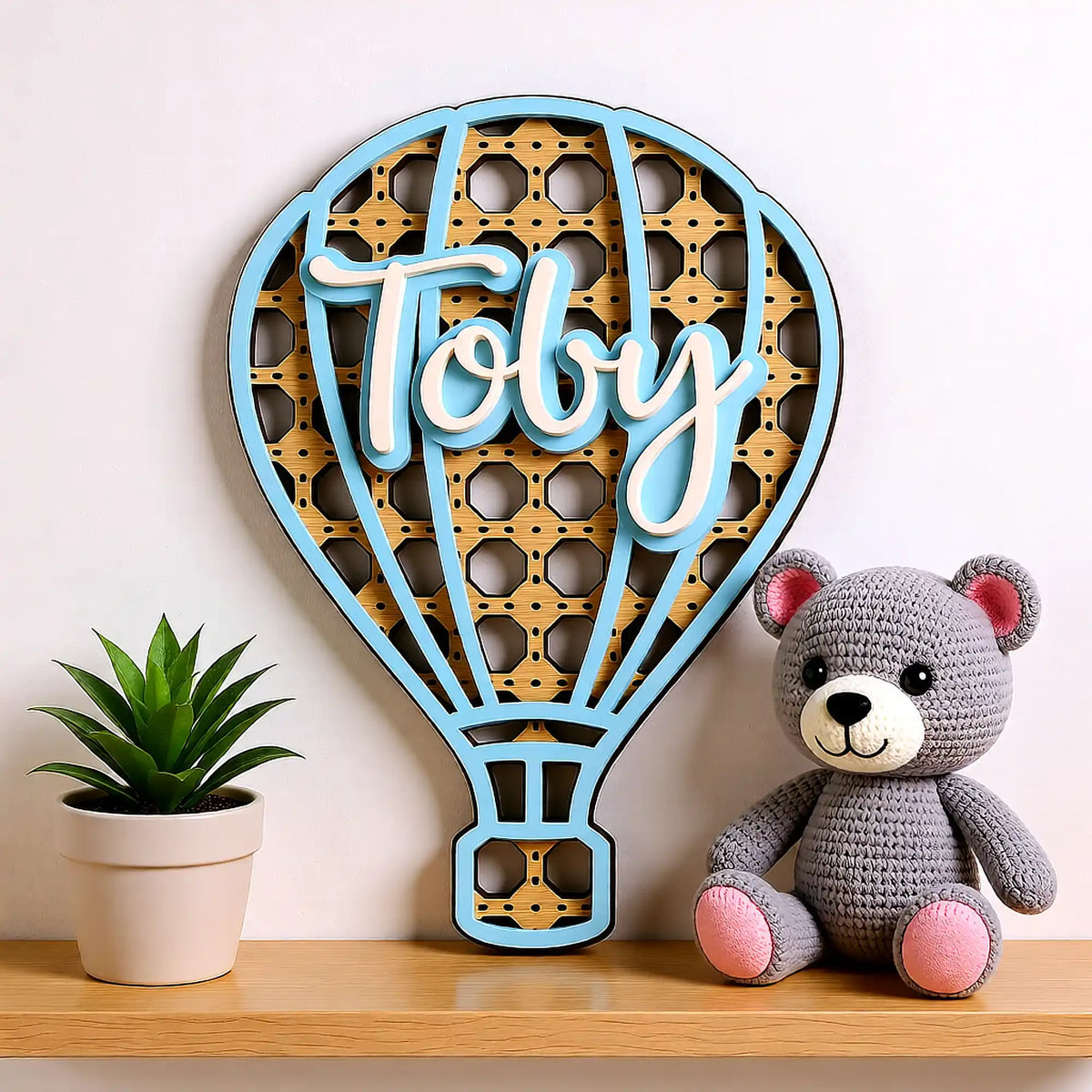 Rattan hot air balloon name plaque for nursery setting