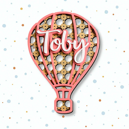 rattan balloon name sign with white acrylic name