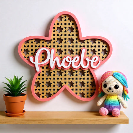 Bespoke wooden nursery name sign with layered floral rattan detail