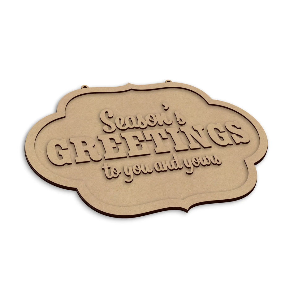 A wooden sign with the words 'Season's Greetings to you and yours' in raised lettering, shown on a plain white background.