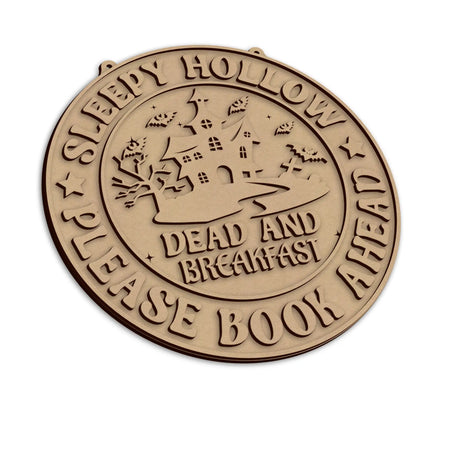 A round wooden halloween plaque, with the text 'SLEEPY HOLLOW PLEASE BOOK AHEAD' and 'DEAD AND BREAKFAST'.