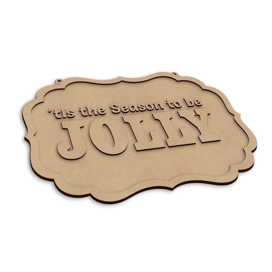 A laser-cut wooden sign with the phrase 'It's the Season to be JOLLY' in raised letters, shown on a plain white background.